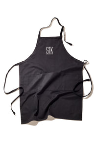 black apron with STK Steakhouse logo